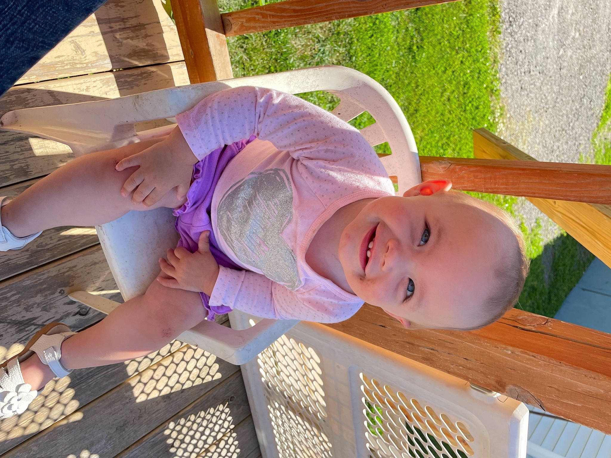 Lorelei is registered to the contest to win money with this photo: baby, baby_toddler_clothing, child, fun, grass, happy, hat, human_leg, joy, leisure, pattern, person, plant, sandal, smile, thigh, toddler, vacation, wood