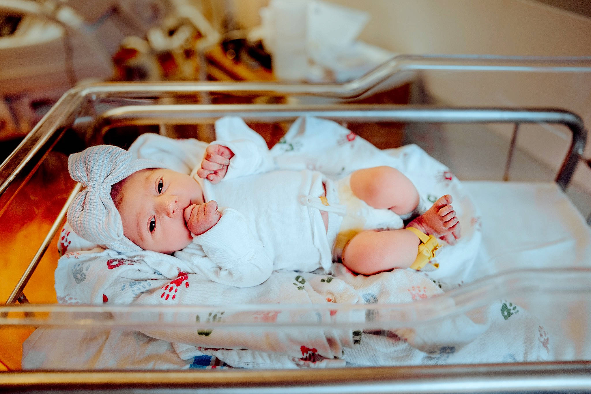 Ember is registered to the contest to win money with this photo: baby, baby_products, baby_sleeping, baby_toddler_clothing, bed, bedtime, child, comfort, event, eye, hat, head, headwear, hospital, human_body, linens, person, product, room, skin