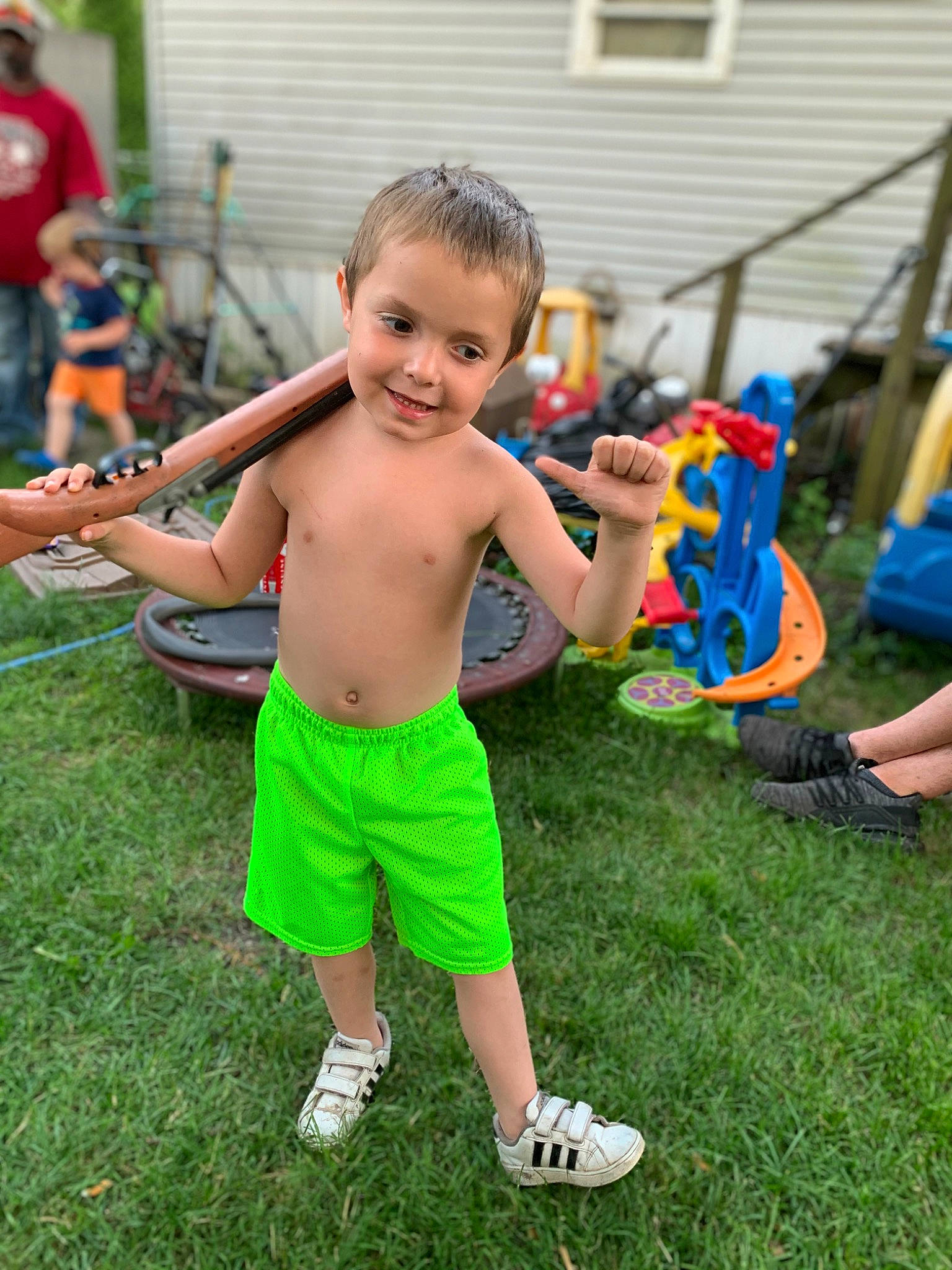Bryson is registered to the contest to win money with this photo: barechested, child, community, event, fun, grass, happy, joy, leisure, person, recreation, sandal, shoe, shorts, smile, sneakers, summer, t_shirt, thumb, toddler