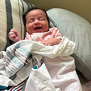 Joshlynn joined the competition — help win amazing prizes! baby, newborn, smiling, blanket, pillow, cushion, infant, sleeping, face, clothing, bed, resting, happy, indoors, person, bottle, soft, comfort, cute, relaxed