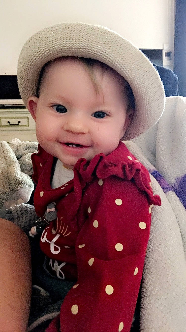 Clary participe au concours pour gagner de l'argent avec cette photo : baby, baby_toddler_clothing, cap, cheek, chin, dress, eye, face, happy, hat, human_body, iris, lip, neck, outerwear, person, photograph, skin, sleeve, smile