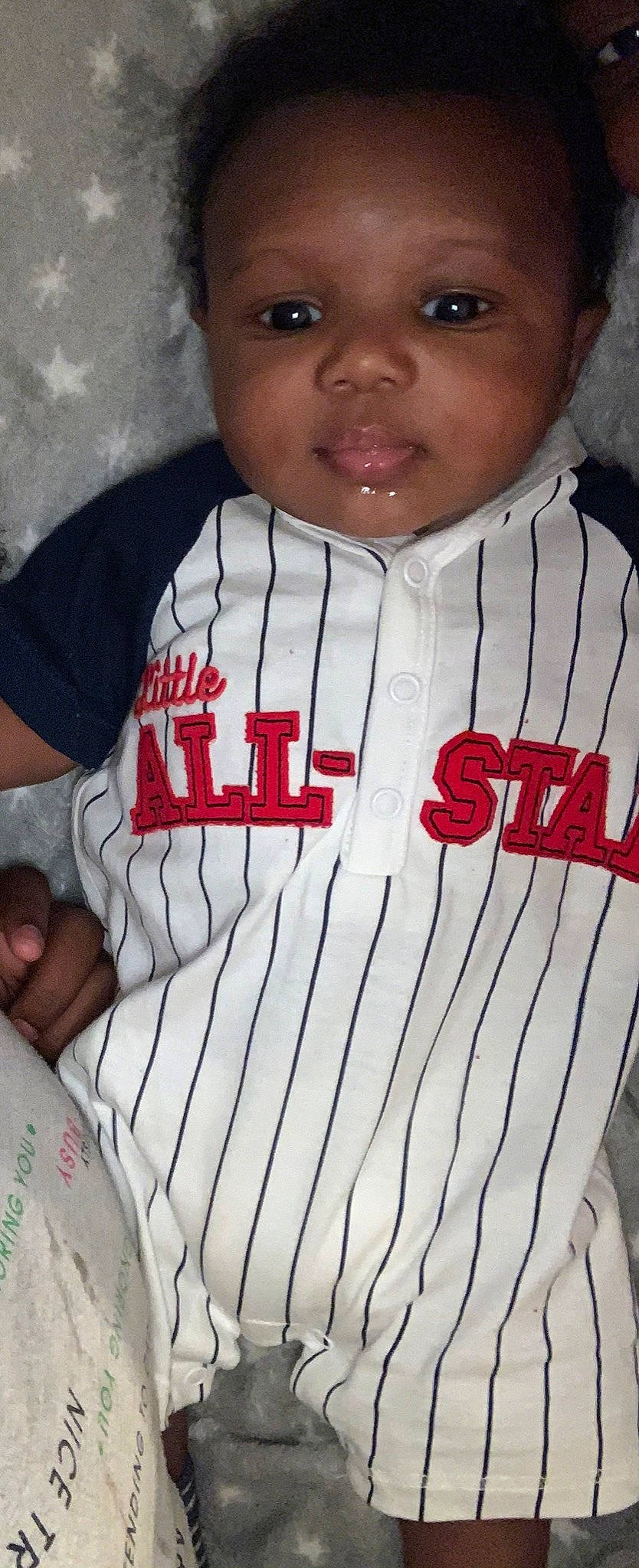 Xane is registered to the contest to win money with this photo: active_shirt, baby, baby_toddler_clothing, carmine, cheek, chin, cool, flesh, forehead, lip, person, skin, sleeve, sports_jersey, white