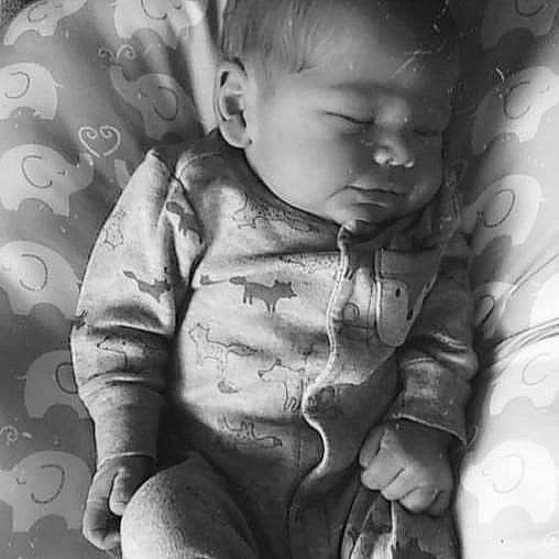 Sawyer Maverick is registered to the contest to win money with this photo: arm, black_and_white, cheek, chin, comfort, eye, finger, flash_photography, hair, hairstyle, hand, head, human_body, iris, mouth, nose, person, skin, sleeve, smile