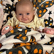 Haylee joined the competition — help win amazing prizes! baby, blanket, butterfly_pattern, star_pattern, plush_toy, smiling, face, infant, cute, cozy, child, soft_texture, warm, lying_down, indoors, person, comfort, happy, wearing_clothes, pink