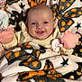 Haylee joined the competition — help win amazing prizes! baby, blanket, butterfly_pattern, mittens, pacifier, smiling, infant, cozy, cute, child, face, happy, soft_texture, warm, indoor, portrait, wrapped, lying_down, colorful, playful