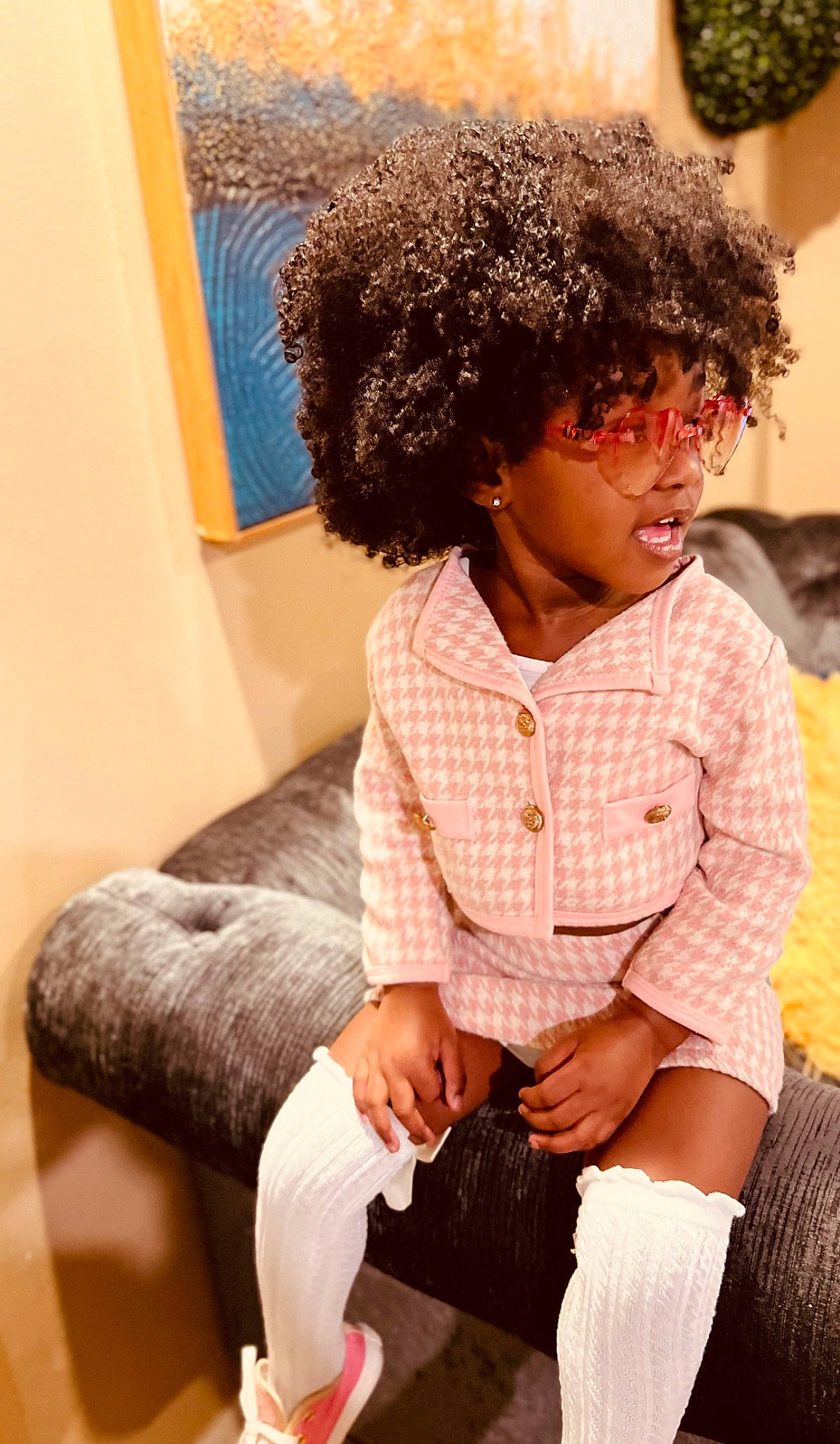 Island joined the competition — help win amazing prizes! afro, child, couch, fashion_design, flooring, fun, fur, happy, human_leg, jheri_curl, knee, leg, person, picture_frame, ringlet, sitting, sleeve, sock, thigh, toddler
