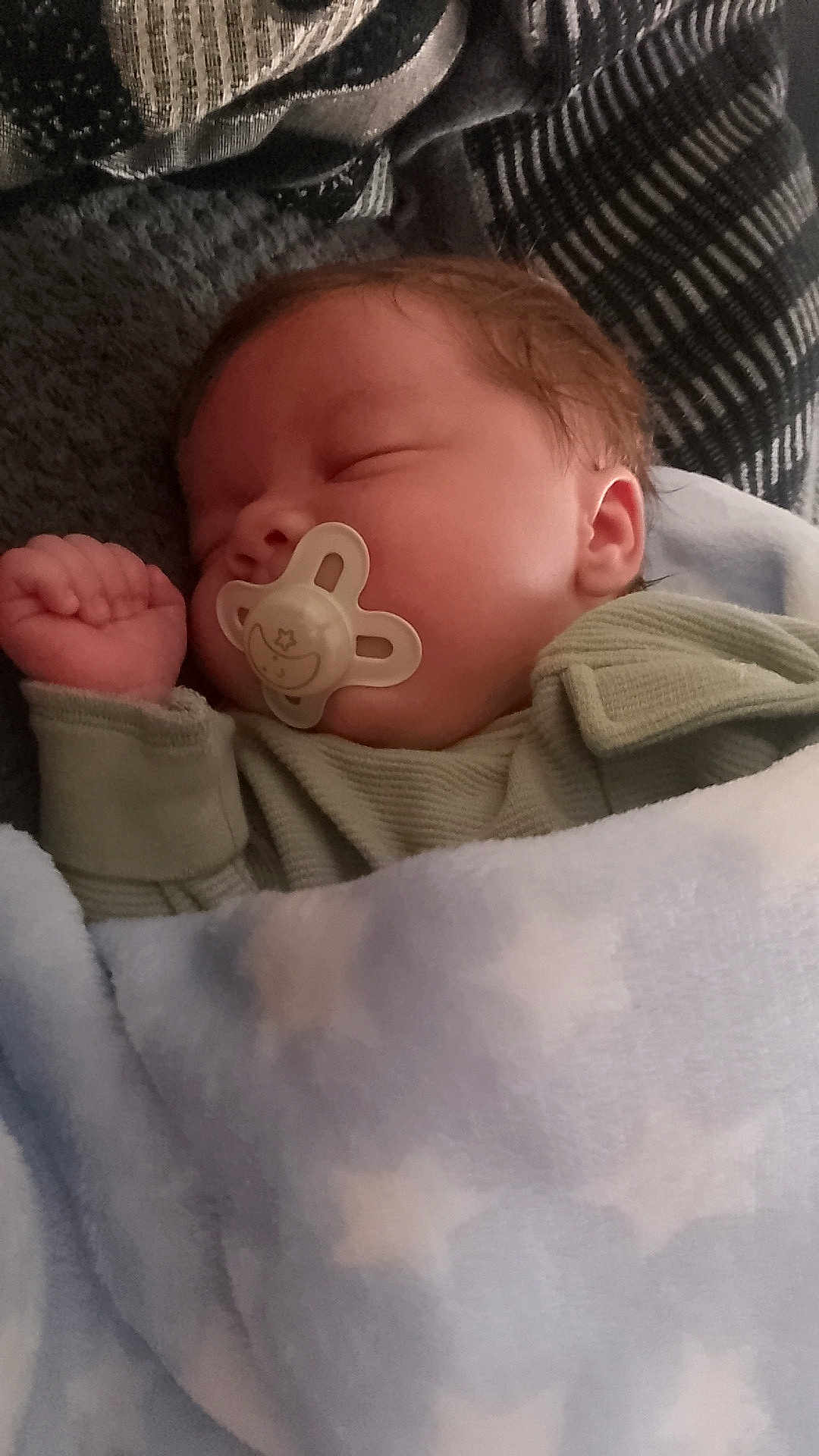 Kyron is registered to the contest to win money with this photo: baby, sleeping, pacifier, blanket, cozy, child, infant, soft, cute, peaceful, rest, nap, clothing, indoors, portrait, closeup, newborn, warm, comfort, peace