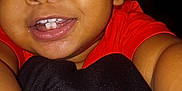 Azlyn joined the competition — help win amazing prizes! toddler, child, smile, face, eyes, teeth, arm, red_shirt, close_up, selfie, happy, baby, skin, portrait, person, indoor, cute, young_child, dark_background, casual