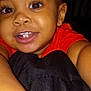 toddler, child, smile, face, eyes, teeth, arm, red_shirt, close_up, selfie, happy, baby, skin, portrait, person, indoor, cute, young_child, dark_background, casual