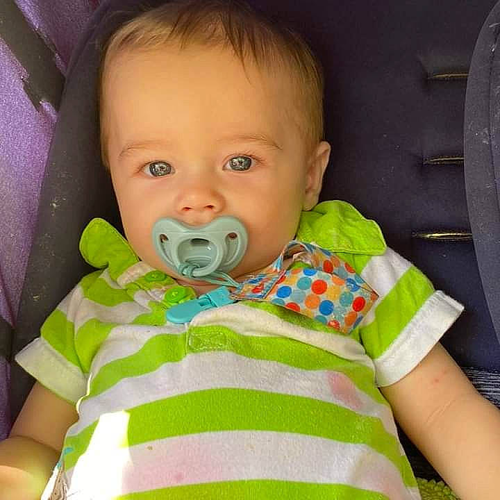 Micah is registered to the contest to win money with this photo: baby, baby_toddler_clothing, cheek, child, chin, collar, comfort, eye, eyebrow, facial_expression, finger, happy, iris, nose, person, product, skin, sleeve, textile, toddler