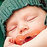 Eryk is registered to the contest to win money with this photo: baby, blanket, child, close_up, comfort, cozy, cute, face, hand, infant, knit_hat, naptime, newborn, pacifier, peaceful, portrait, resting, sleeping, soft_texture, warm