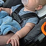 Eryk is registered to the contest to win money with this photo: baby, car_seat, pacifier, blanket, child, infant, straps, sitting, blue, clothing, hand, warning_label, seat_belt, safety, interior, car, young_child, cute, comfort, relaxing