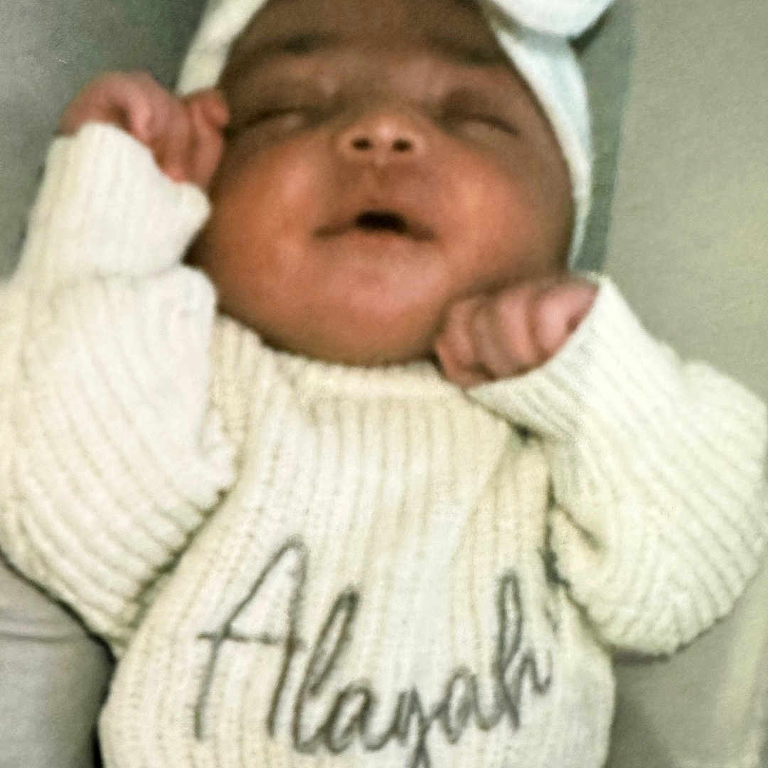 Alayah-Leigh joined the competition — help win amazing prizes! baby, bow, child, closeup, cozy, cute, face, hands, headband, indoors, infant, knitted_sweater, newborn, peaceful, portrait, resting, sleeping, soft_lighting, warm_clothing, young_child