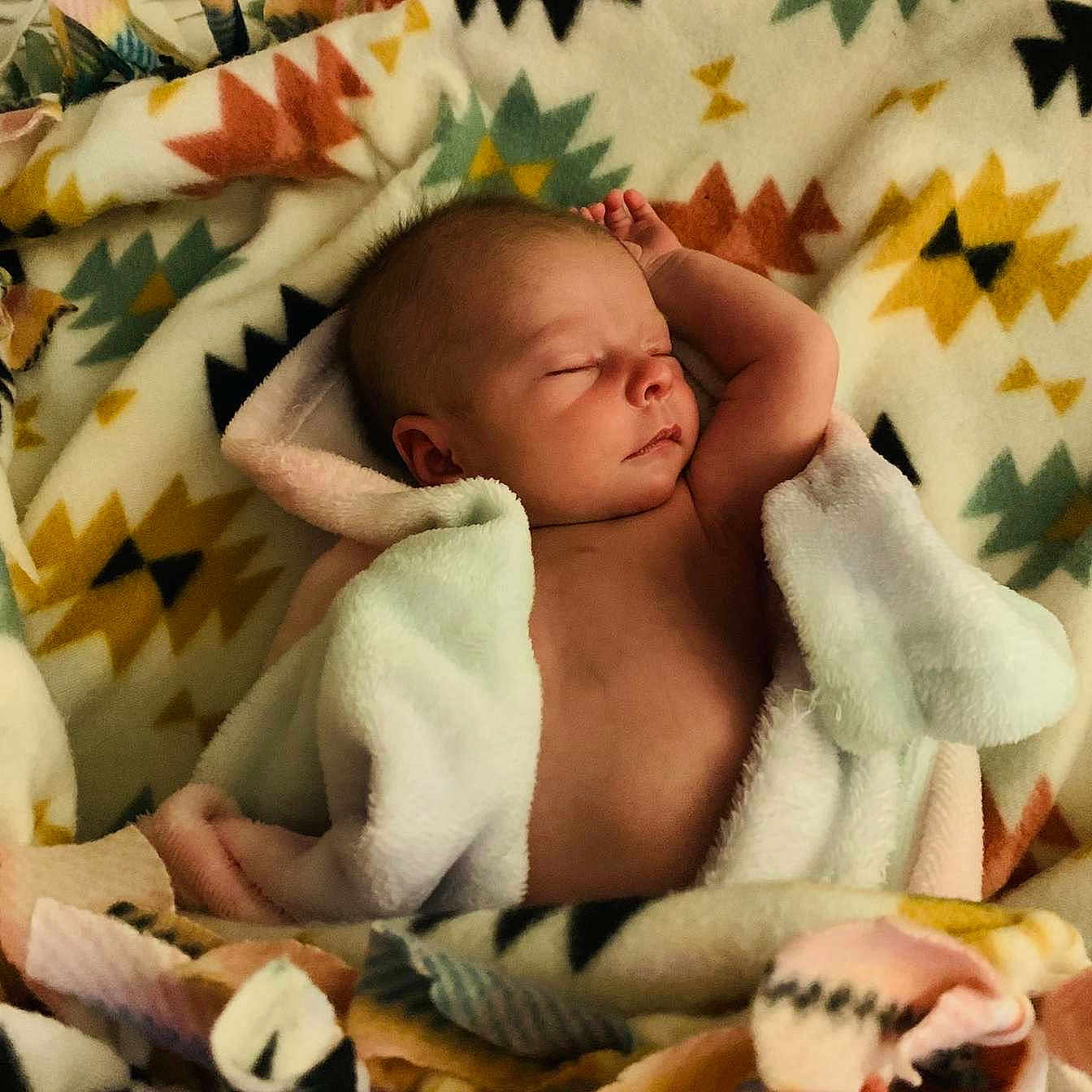 Willow is registered to the contest to win money with this photo: baby, blanket, childbirth, face, head, newborn, person, photography, portrait, quilt, sleeping, towel