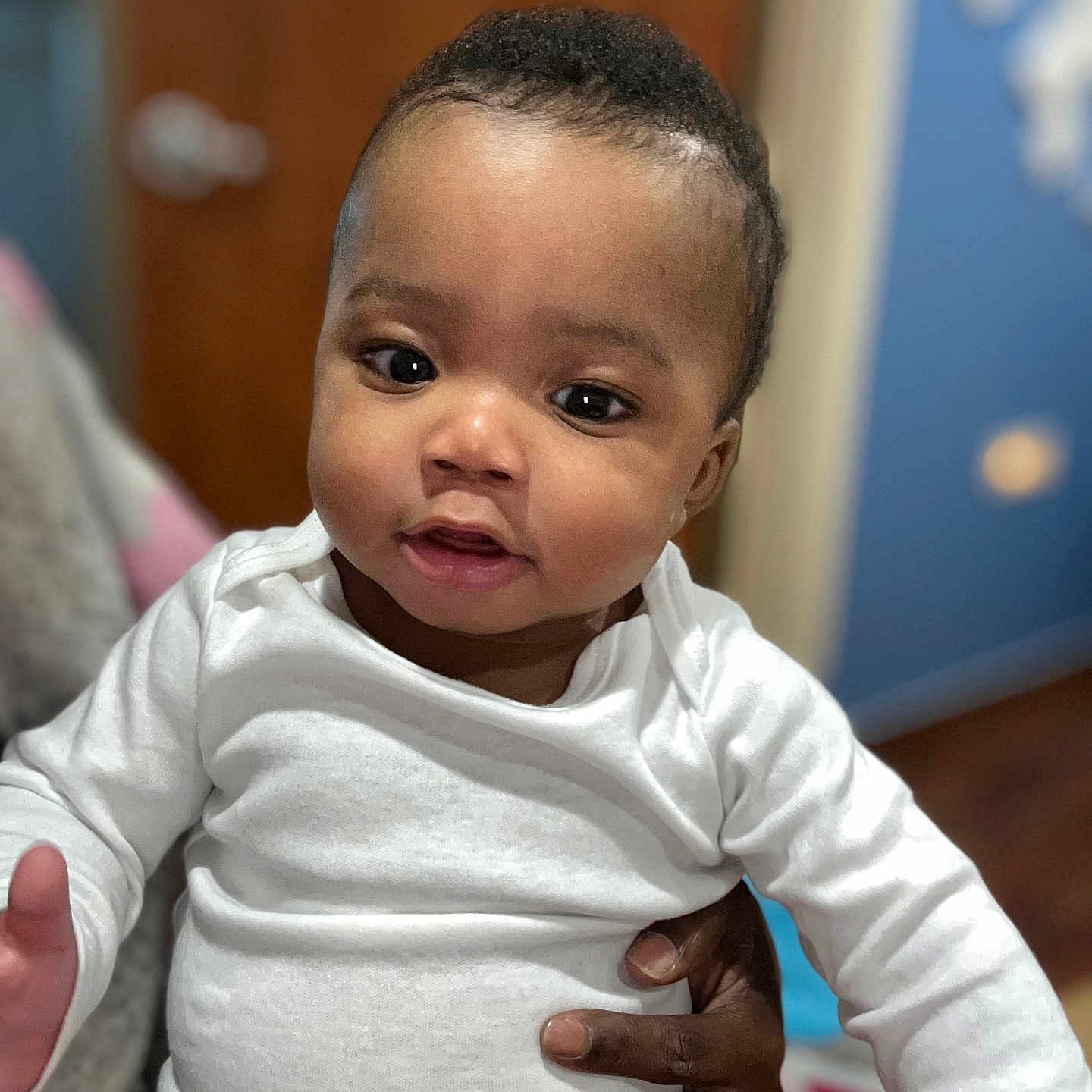 Makari joined the competition — help win amazing prizes! baby, blackhair, bodypart, clothing, face, finger, frown, hair, hand, happy, head, neck, newborn, person, photography, portrait, shoulder, skin, sleeve, smile