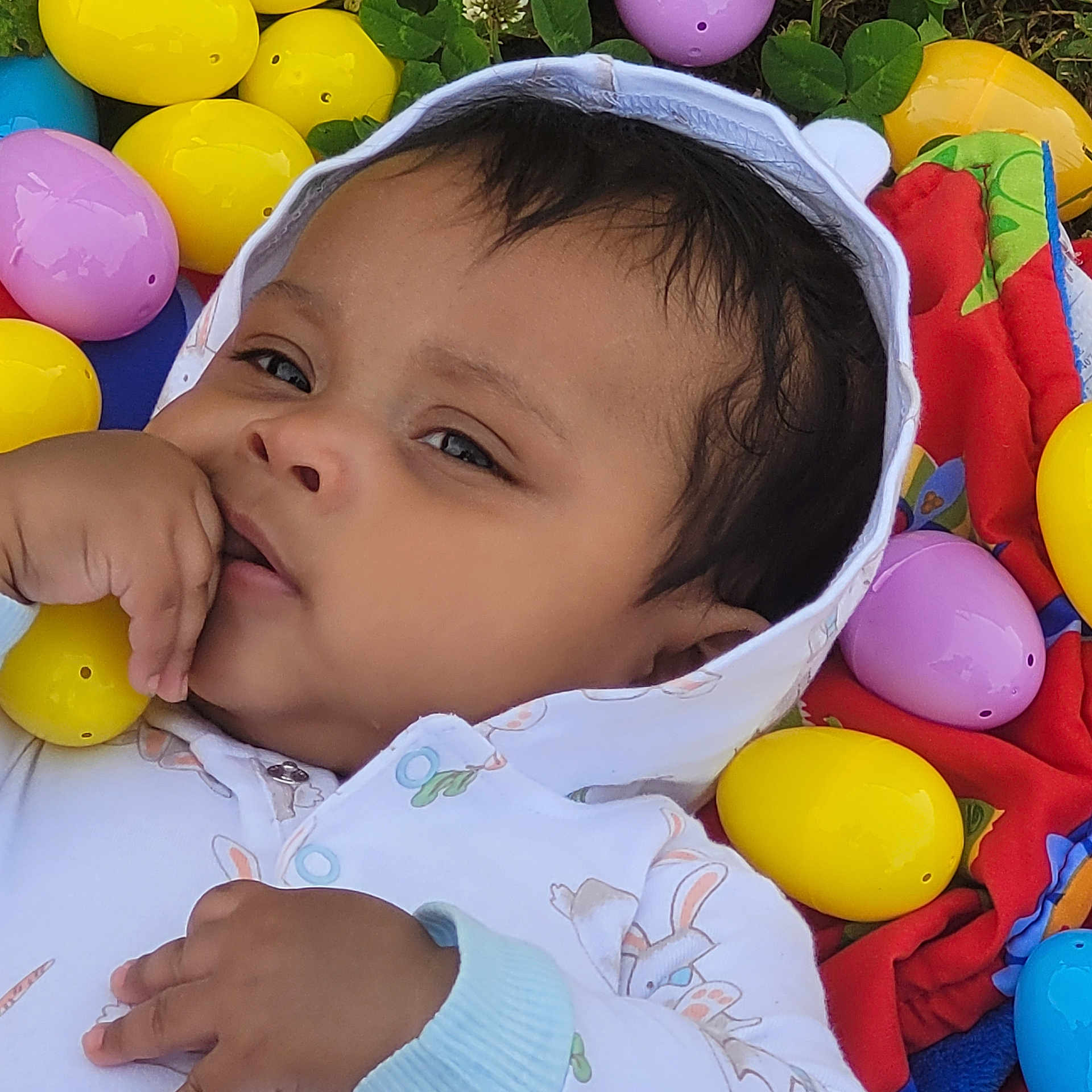 Simon joined the competition — help win amazing prizes! baby, balloon, bodypart, bonnet, clothing, egg, face, finger, food, hand, hat, head, hood, knitwear, person, photography, portrait, purple, sphere, sweater