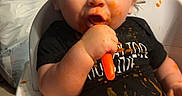 Anthony joined the competition — help win amazing prizes! toddler, baby, high_chair, messy, food, baby_food, spoon, orange_food, blue_eyes, child, indoor, cute, smudged_face, feeding, funny, infant, plastic_jar, candid, eating, portrait