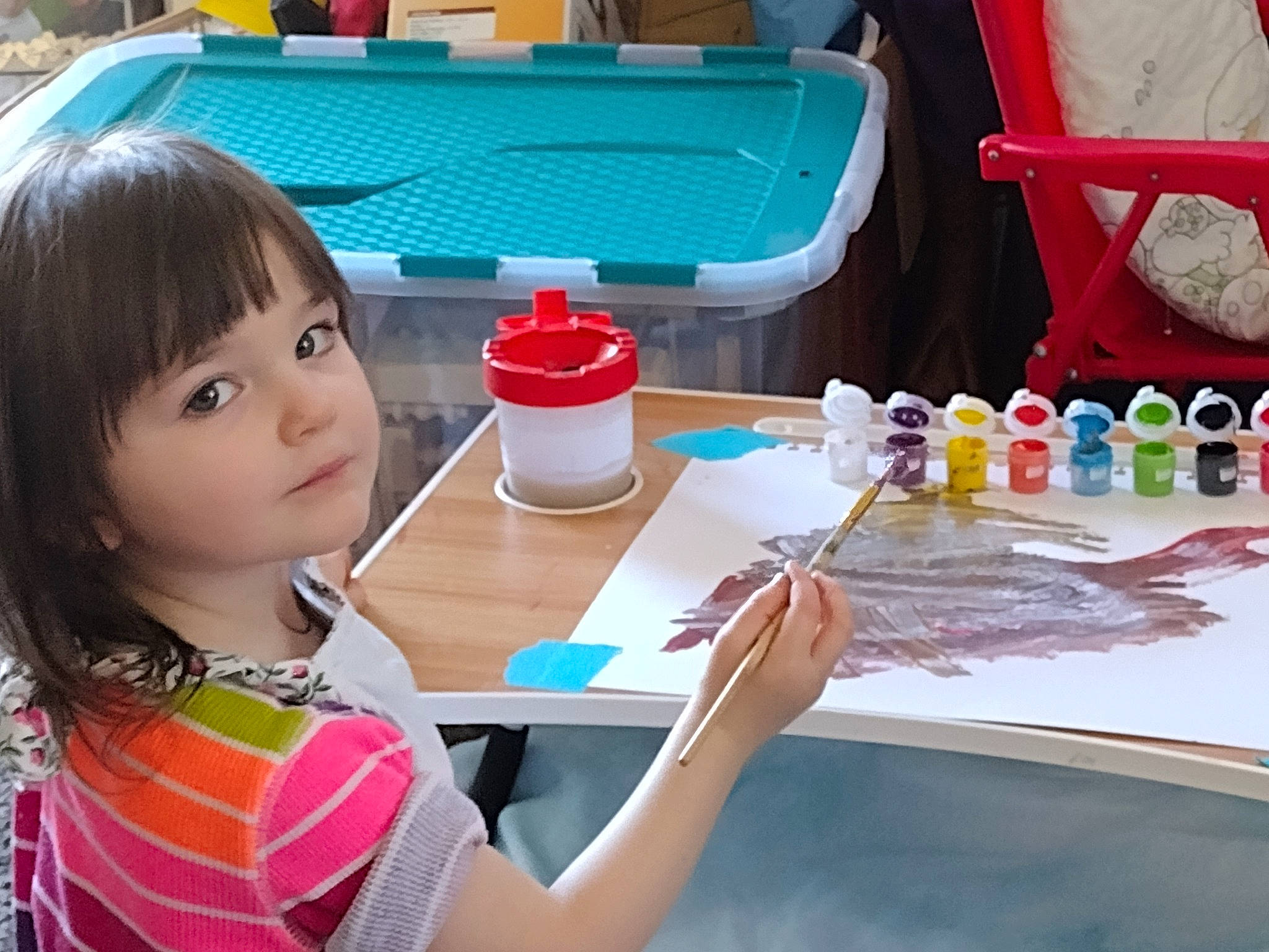 Amber is registered to the contest to win money with this photo: artist, chair, child, event, finger, fun, leisure, nail, person, photograph, plate, play, recreation, sharing, snapshot, summer, t_shirt, table, tableware, toddler