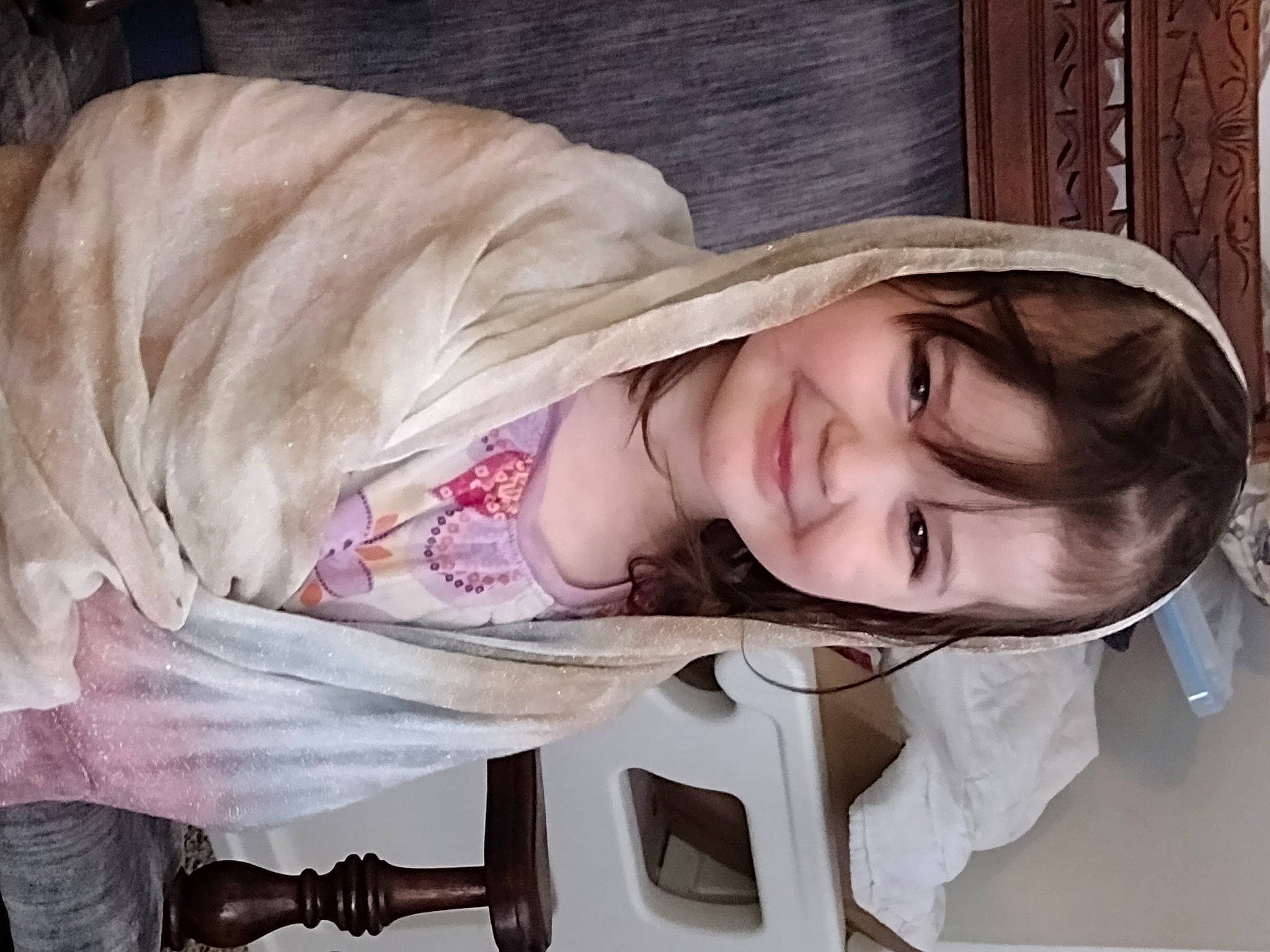 Amber is registered to the contest to win money with this photo: baby_products, blond, child, comfort, eyelash, eyewear, fashion_accessory, happy, joy, person, portrait_photography, skin, sleeve, smile, toddler, wood