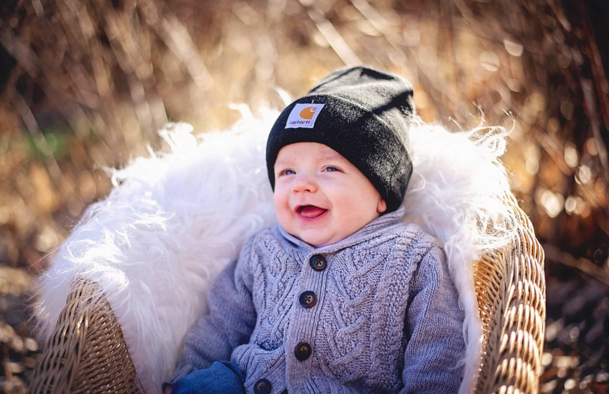 Bowen is registered to the contest to win money with this photo: baby, cap, fashion_accessory, flash_photography, freezing, fun, fur, fur_clothing, grass, happy, headgear, headwear, iris, outerwear, people_in_nature, person, smile, textile, toddler, tradition