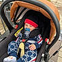 baby, baby_clothes, baby_seat, black, canopy, child, clothing, comfort, cute, footwear, hat, infant, jacket, outdoor, pacifier, red, safety_harness, seatbelt, socks, stroller