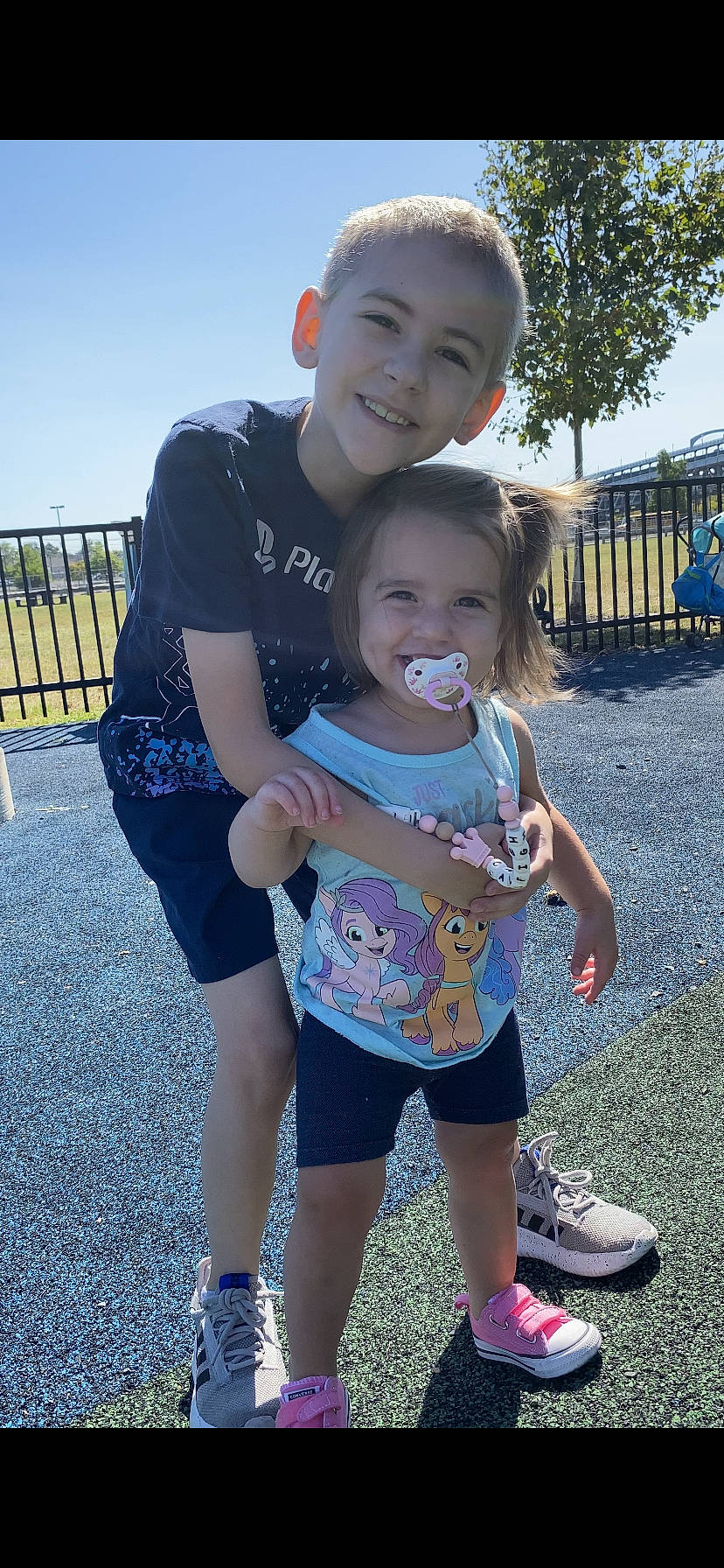 Caleigh joined the competition — help win amazing prizes! blue, eye, facial_expression, gesture, grass, hair, hairstyle, happy, head, human, joy, leisure, mouth, organ, person, shorts, skin, sky, smile, standing