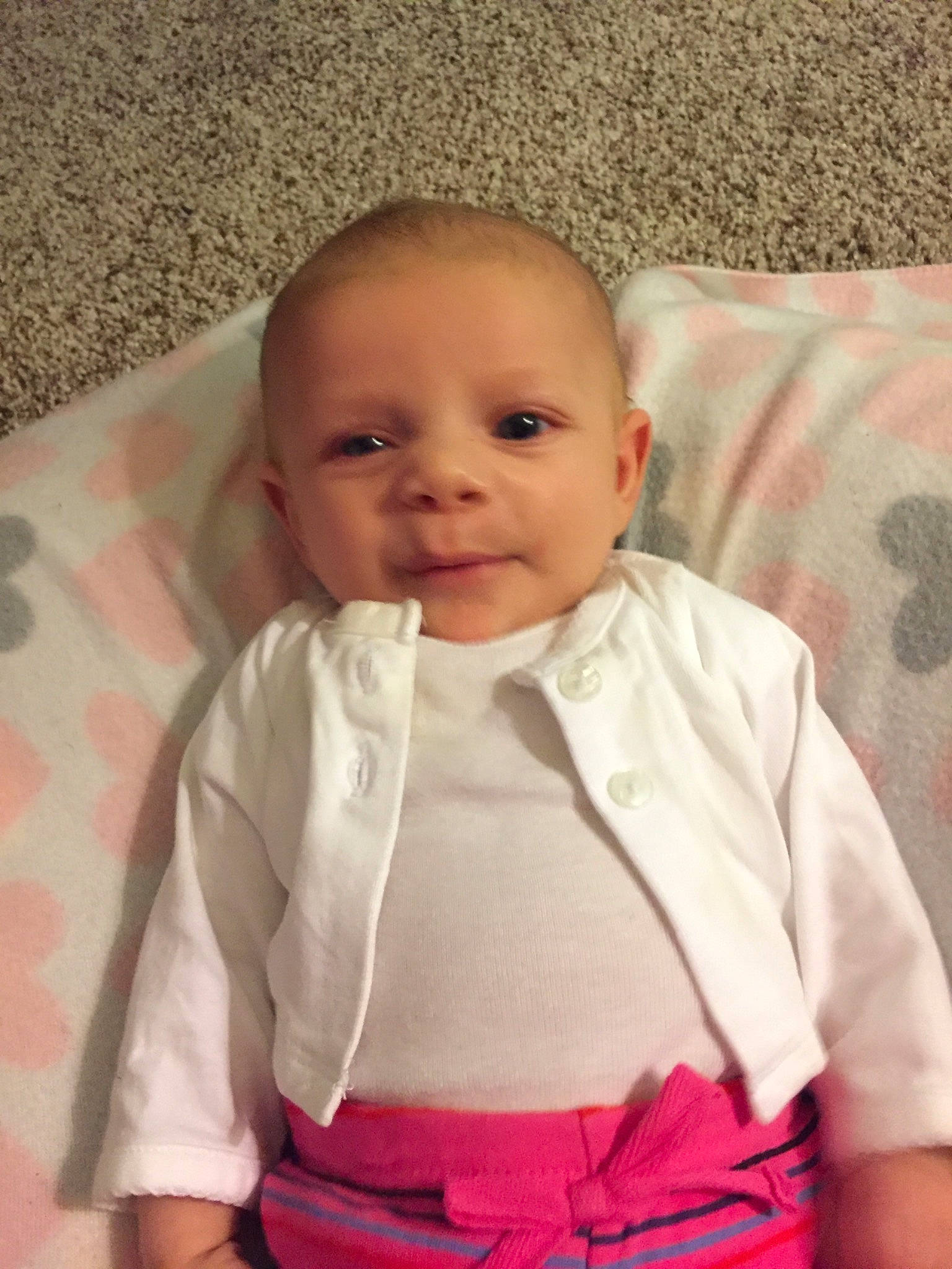 Kaleigha joined the competition — help win amazing prizes! baby, baby_products, cheek, child, dress, eye, face, facial_expression, head, lip, mouth, nose, person, pink, product, sitting, skin, smile, toddler