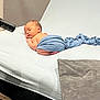 Frankie joined the competition — help win amazing prizes! newborn, baby, sleeping, blue_cloth, blanket, studio_light, white_surface, infant, peaceful, wrapped, soft_fabric, portrait, indoors, resting, cute, child, tiny, skin, head, pose