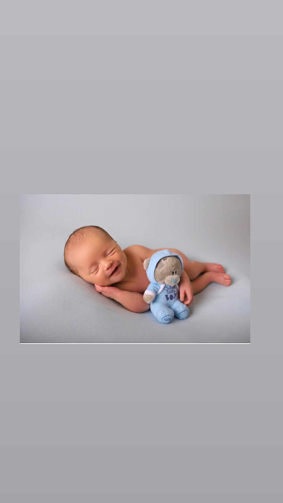 Frankie joined the competition — help win amazing prizes! newborn, baby, smiling, sleeping, plush_toy, teddy_bear, blue_hoodie, soft_surface, infant, cute, peaceful, child, portrait, lying_down, cuddling, adorable, baby_boy, relaxed, small, indoor