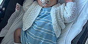 Frankie is registered to the contest to win money with this photo: baby, sleeping, pacifier, stroller, blue_outfit, knit_hat, white_socks, cozy, infant, child, cute, peaceful, soft_lighting, indoor, blanket, comfort, newborn, resting, warm_clothing, portrait