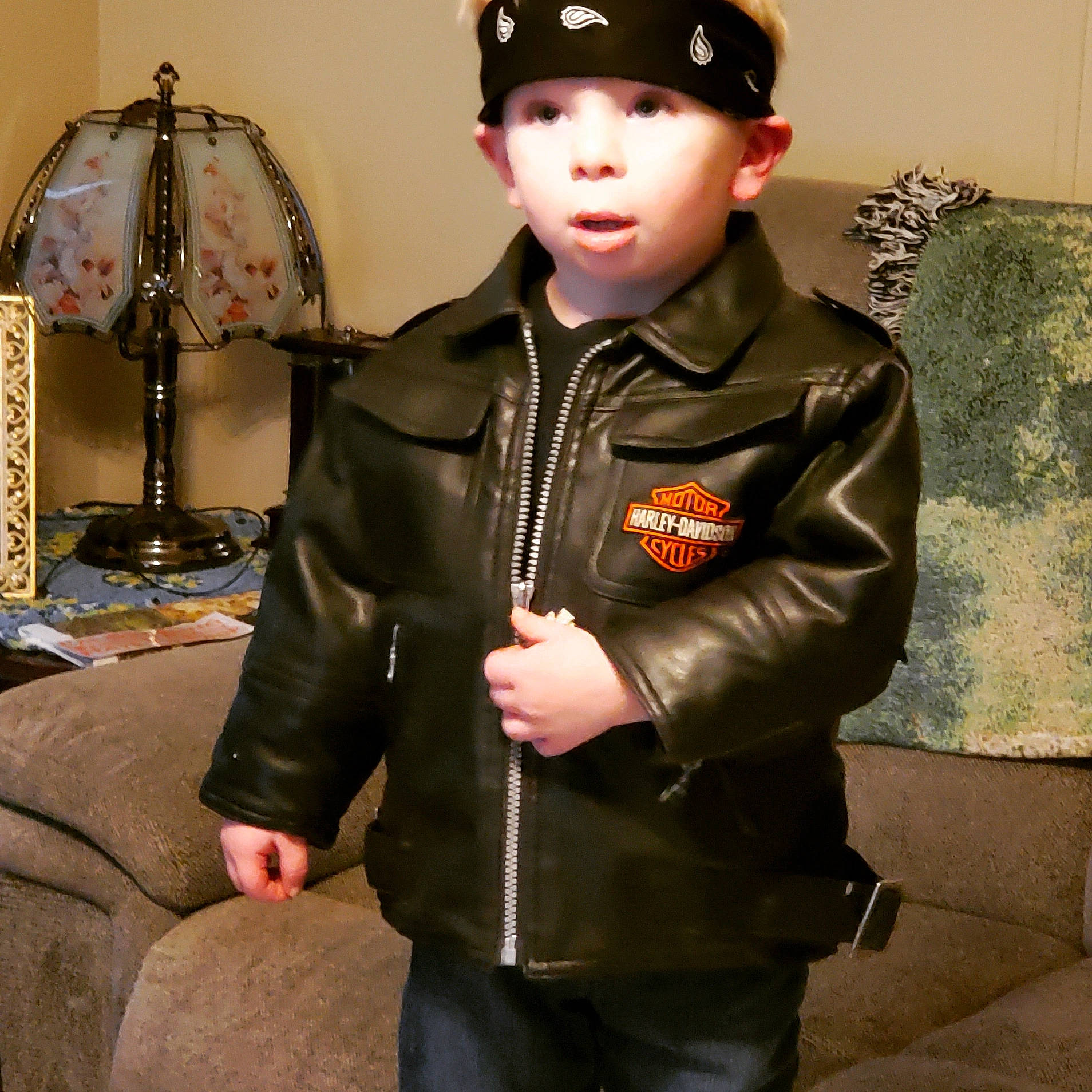 Clint is registered to the contest to win money with this photo: blazer, button, cap, collar, costume_hat, event, face, fashion_accessory, fashion_design, formal_wear, hat, headgear, headwear, leather_jacket, military_person, military_uniform, non_commissioned_officer, outerwear, person, personal_protective_equipment