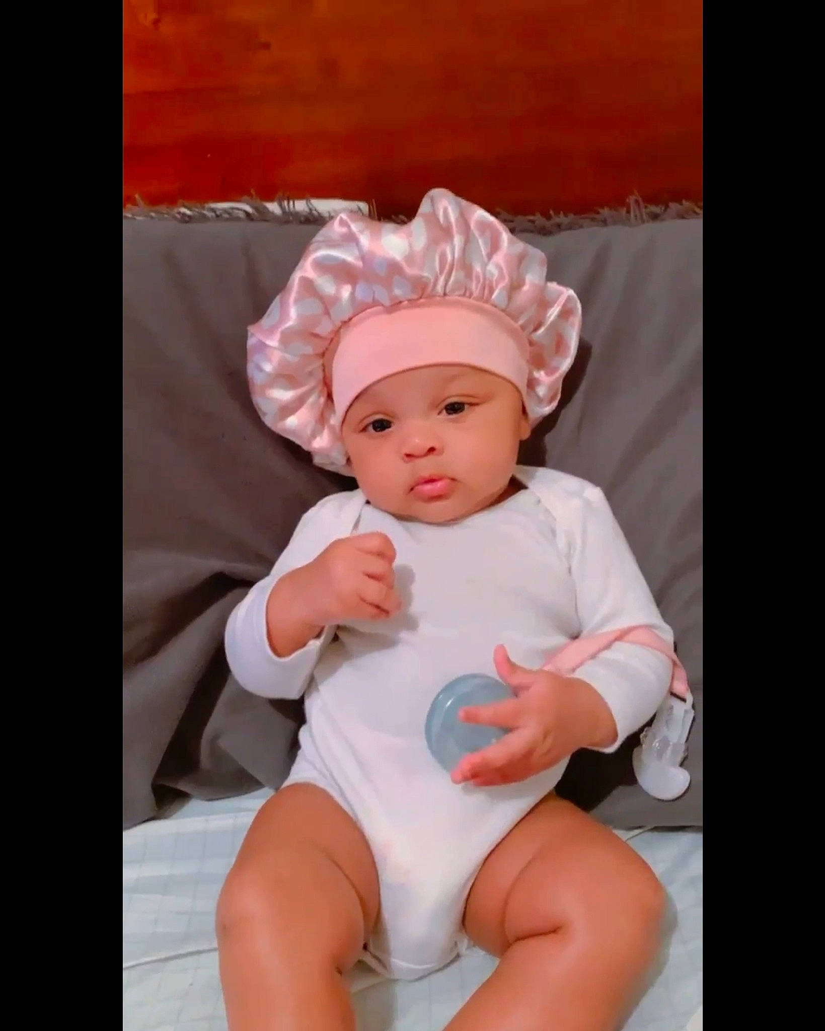 Ka'Mani joined the competition — help win amazing prizes! baby, baby_products, baby_toddler_clothing, chair, cheek, child, comfort, fashion_accessory, fun, happy, headgear, headwear, human_leg, knee, peach, person, room, sitting, sleeve, thigh