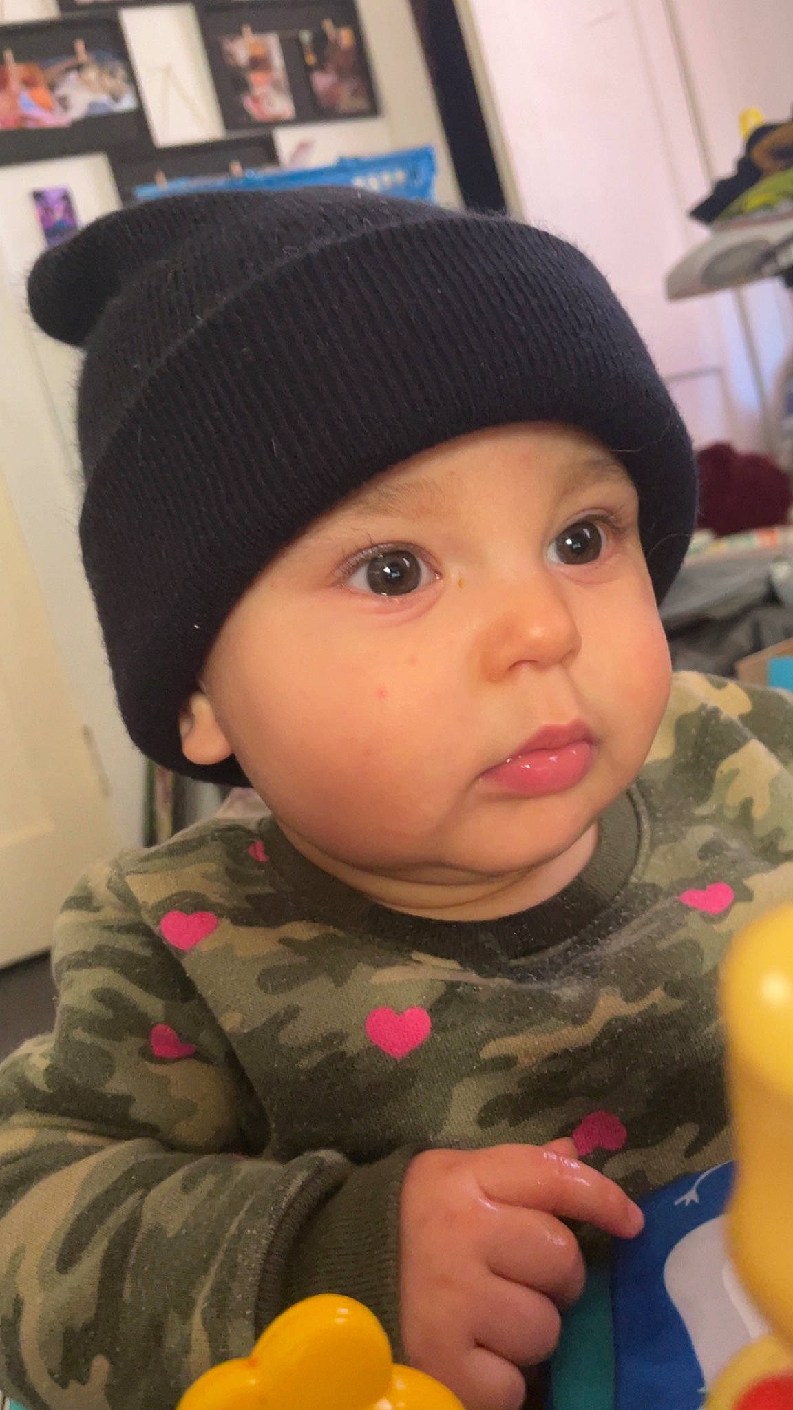 Nyla joined the competition — help win amazing prizes! baby, baby_toddler_clothing, cap, cheek, child, eye, face, fashion_accessory, head, headgear, headwear, knit_cap, lip, military_camouflage, nose, person, personal_protective_equipment, skin, sleeve, snapshot