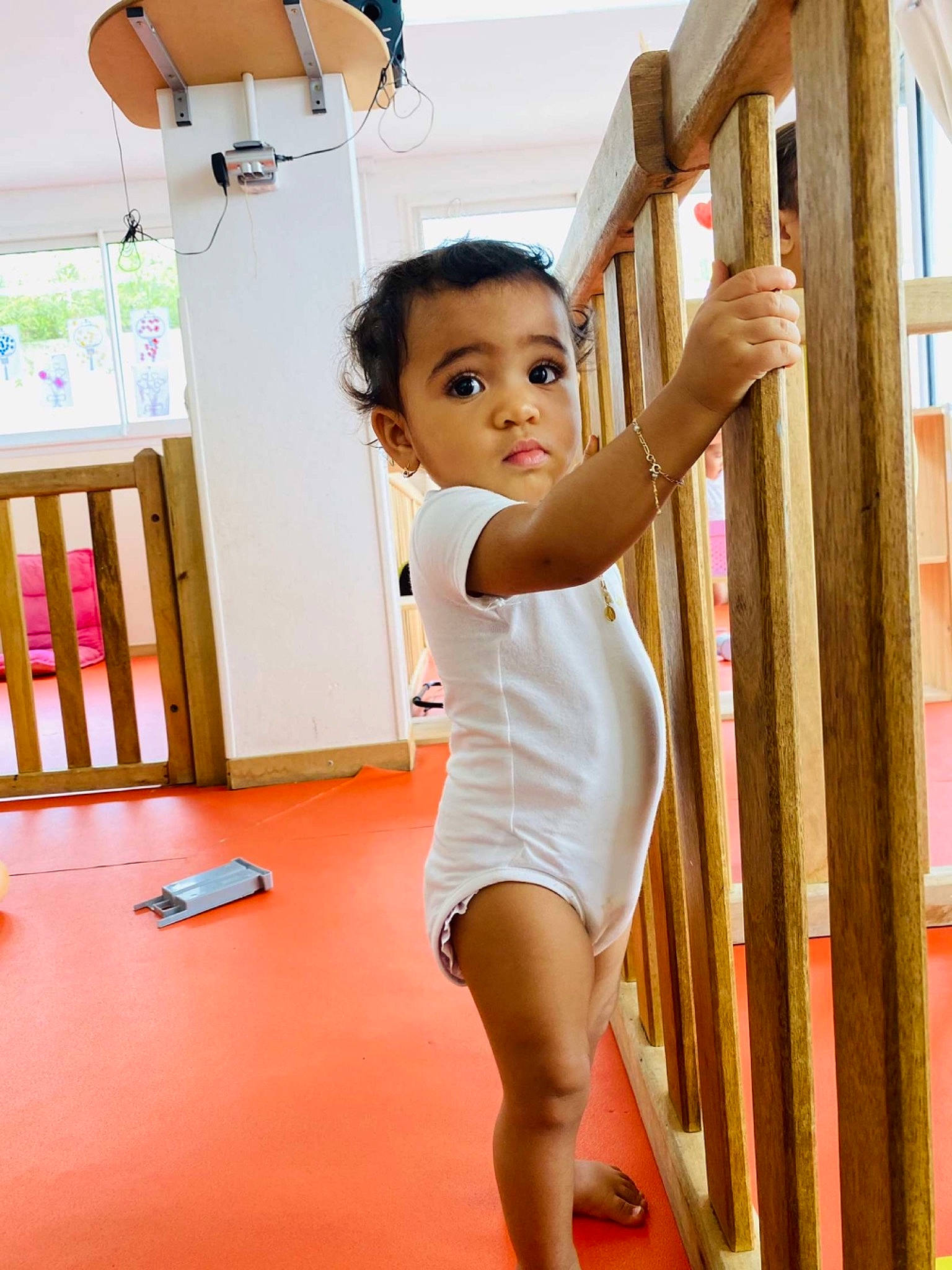 Mya Alyssa participe au concours pour gagner de l'argent avec cette photo : balance, chest, child, elbow, flooring, fun, happy, human_leg, knee, leisure, person, play, shorts, skin, standing, summer, table, thigh, toddler, trunk