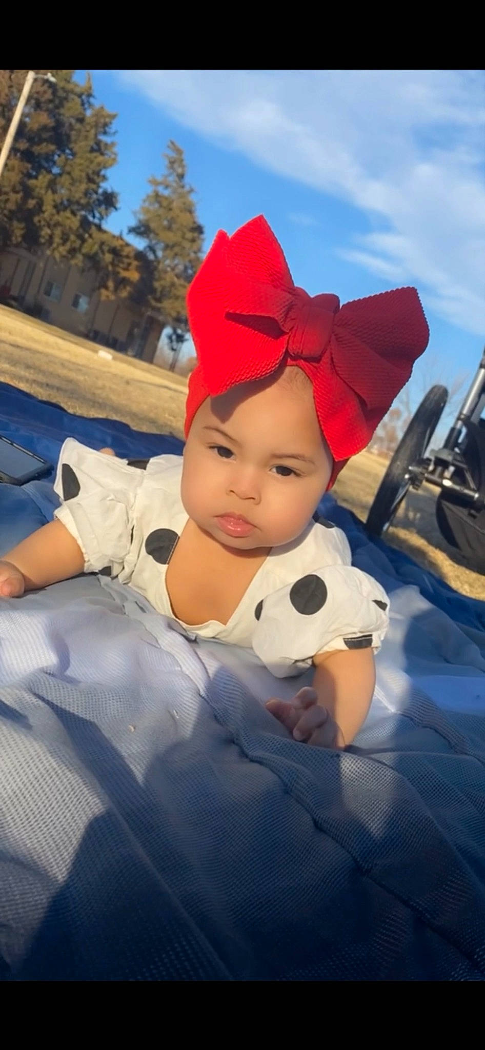 Alaiyah joined the competition — help win amazing prizes! baby, cap, carmine, child, cloud, costume_hat, fictional_character, fun, grass, happy, hat, headwear, leisure, mammal, person, recreation, sitting, sky, toddler, tree