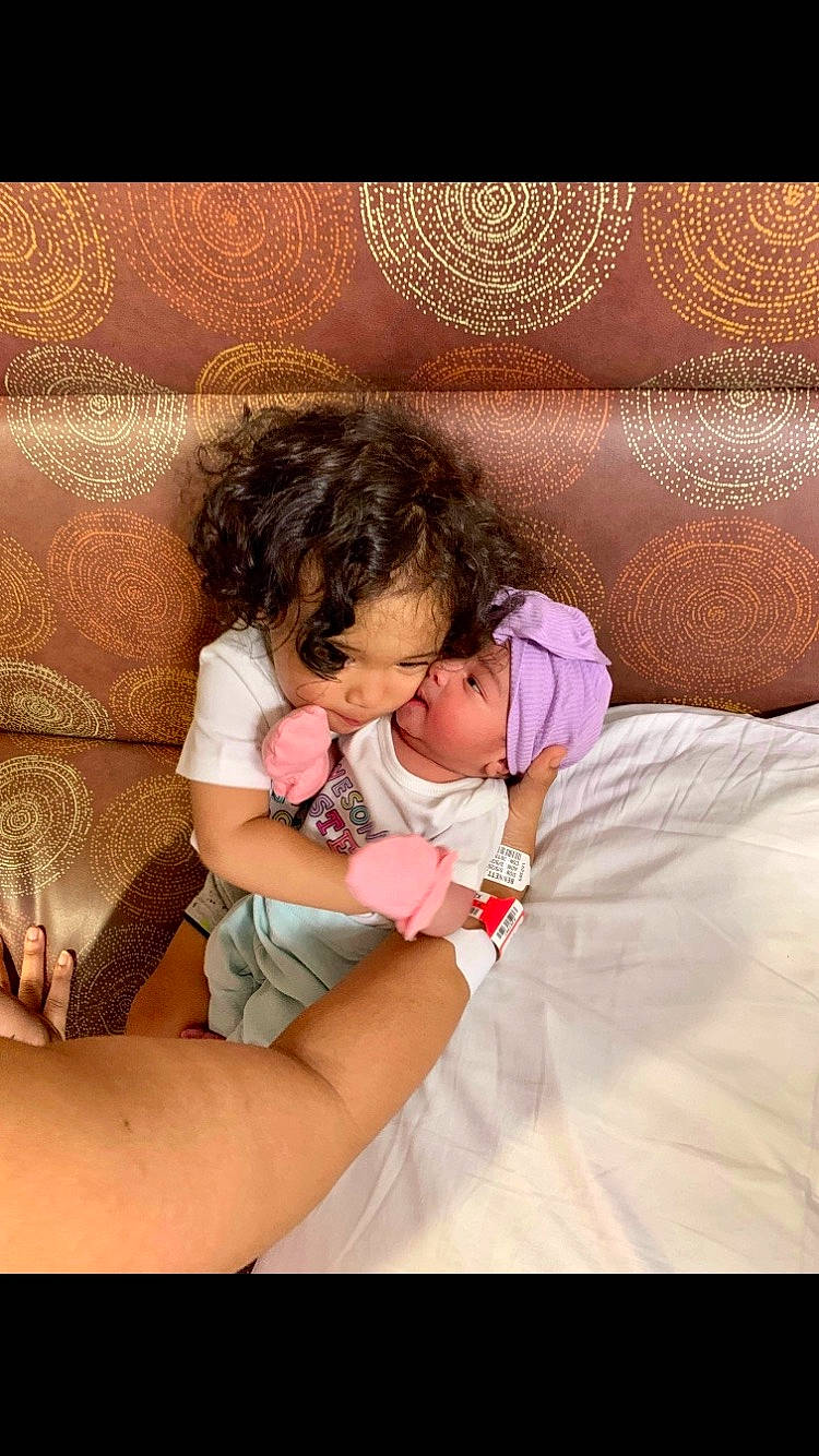 Aayden joined the competition — help win amazing prizes! abdomen, arm, baby, baby_toddler_clothing, bedtime, child, comfort, couch, event, gesture, happy, headwear, human_leg, lap, linens, nail, pattern, person, sitting, skin