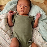 Octavio joined the competition — help win amazing prizes! baby, infant, newborn, onesie, blanket, soft_texture, striped_cloth, lying_down, indoors, skin, face, hands, feet, cute, calm, child, sleepwear, comfort, cozy, portrait