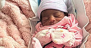 Melanii is registered to the contest to win money with this photo: newborn, baby, sleeping, blanket, pink, mittens, hat, cozy, infant, soft, wrapped, closeup, child, cute, resting, indoors, portrait, peaceful, warm, toddler