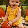 Patience is registered to the contest to win money with this photo: baby, child, toddler, smiling, portrait, outdoor, autumn, fall, pumpkin, orange, yellow_dress, dress, sitting, nature, trees, leaves, blanket, harvest, happy, photography