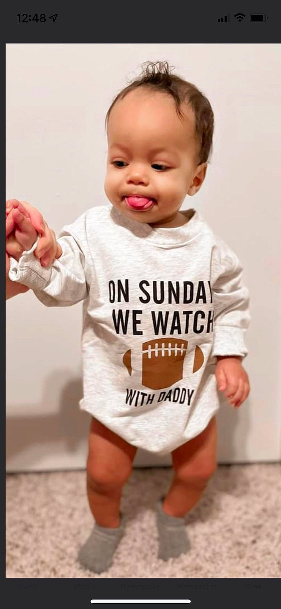 Jalin is registered to the contest to win money with this photo: baby, baby_toddler_clothing, child, face, facial_expression, fashion_design, finger, font, gesture, happy, head, logo, neck, person, sleeve, smile, sportswear, standing, t_shirt, toddler