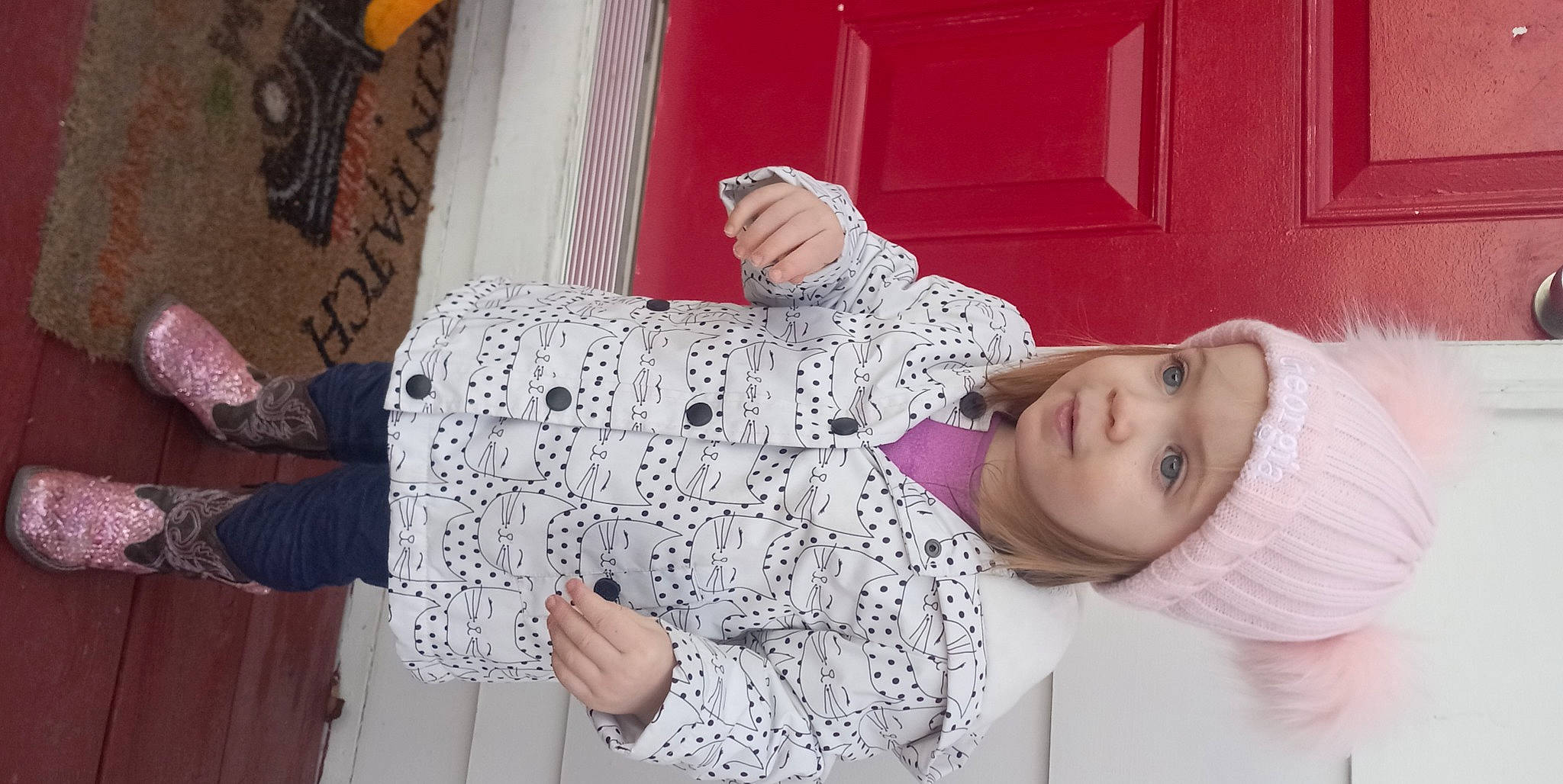 Georgia is registered to the contest to win money with this photo: arm, baby_toddler_clothing, child, door, finger, fun, hand, happy, headwear, magenta, pattern, person, pink, product, purple, room, skin, sleeve, smile, thumb