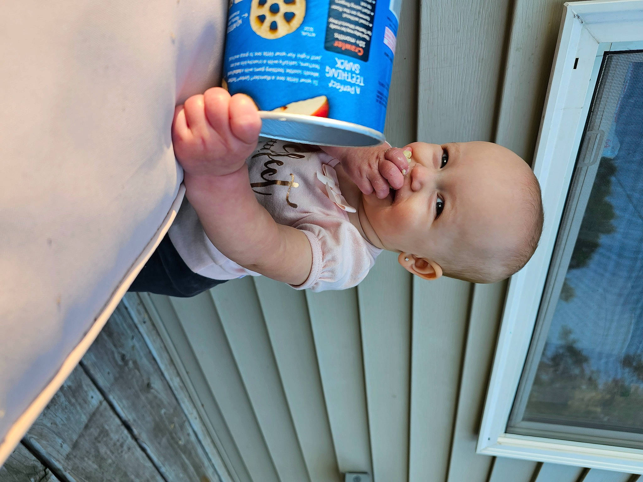 Maeve joined the competition — help win amazing prizes! baby, baby_products, baby_safety, baby_toddler_clothing, blue, book, child, electric_blue, hand, happy, leisure, person, publication, room, smile, toddler, wood