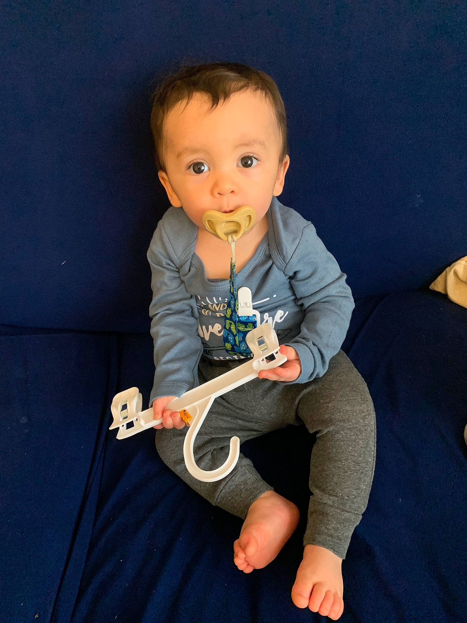 Juno-reed is registered to the contest to win money with this photo: baby, baby_products, baby_toddler_clothing, comfort, elbow, electric_blue, finger, flash_photography, fun, happy, knee, lap, musical_instrument, person, sitting, sleeve, sock, standing, surprise, t_shirt