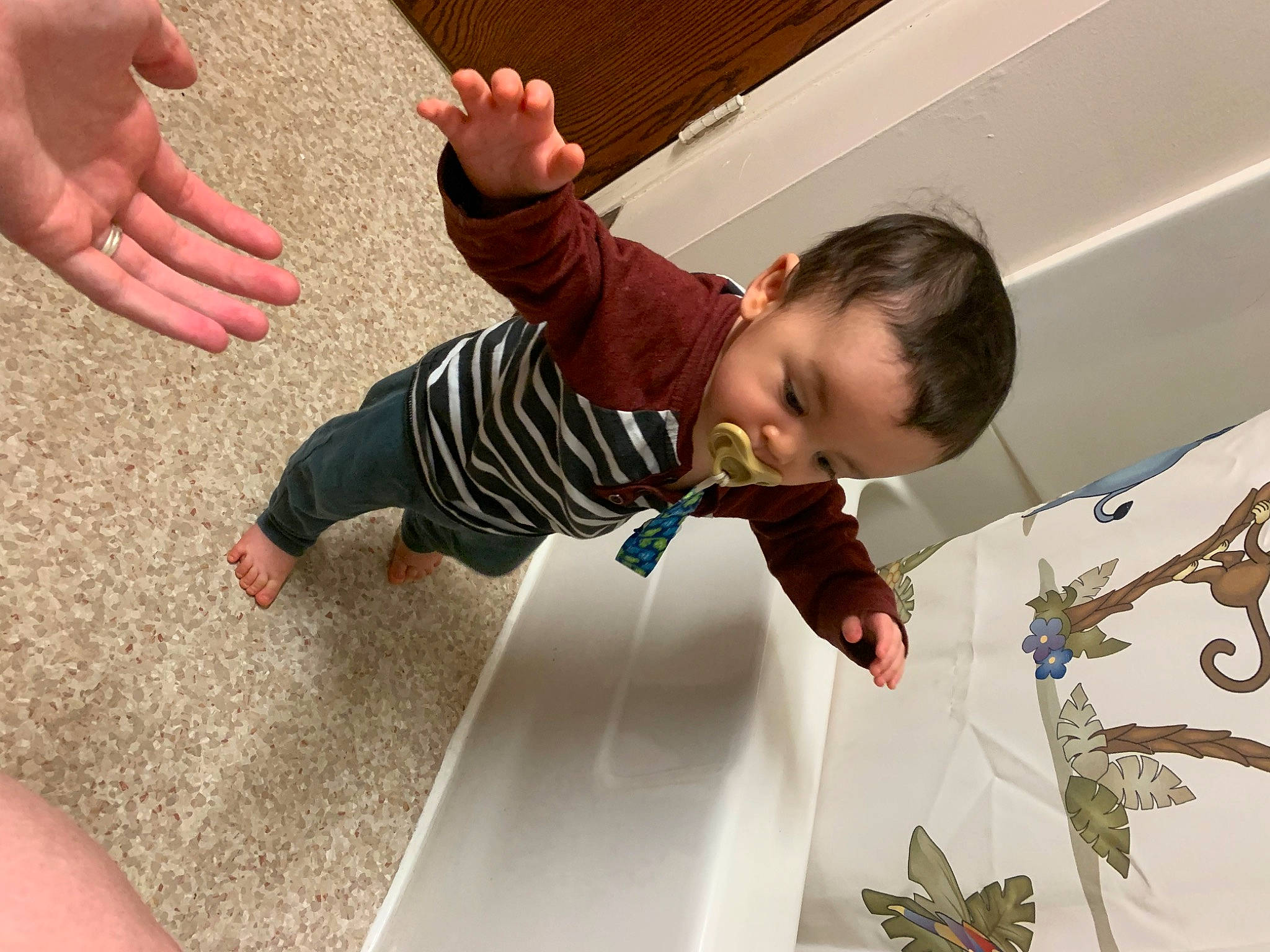 Juno-reed is registered to the contest to win money with this photo: baby, baby_toddler_clothing, barefoot, child, event, finger, floor, flooring, foot, fun, gesture, happy, human_leg, leisure, person, product, t_shirt, thumb, toddler, toe