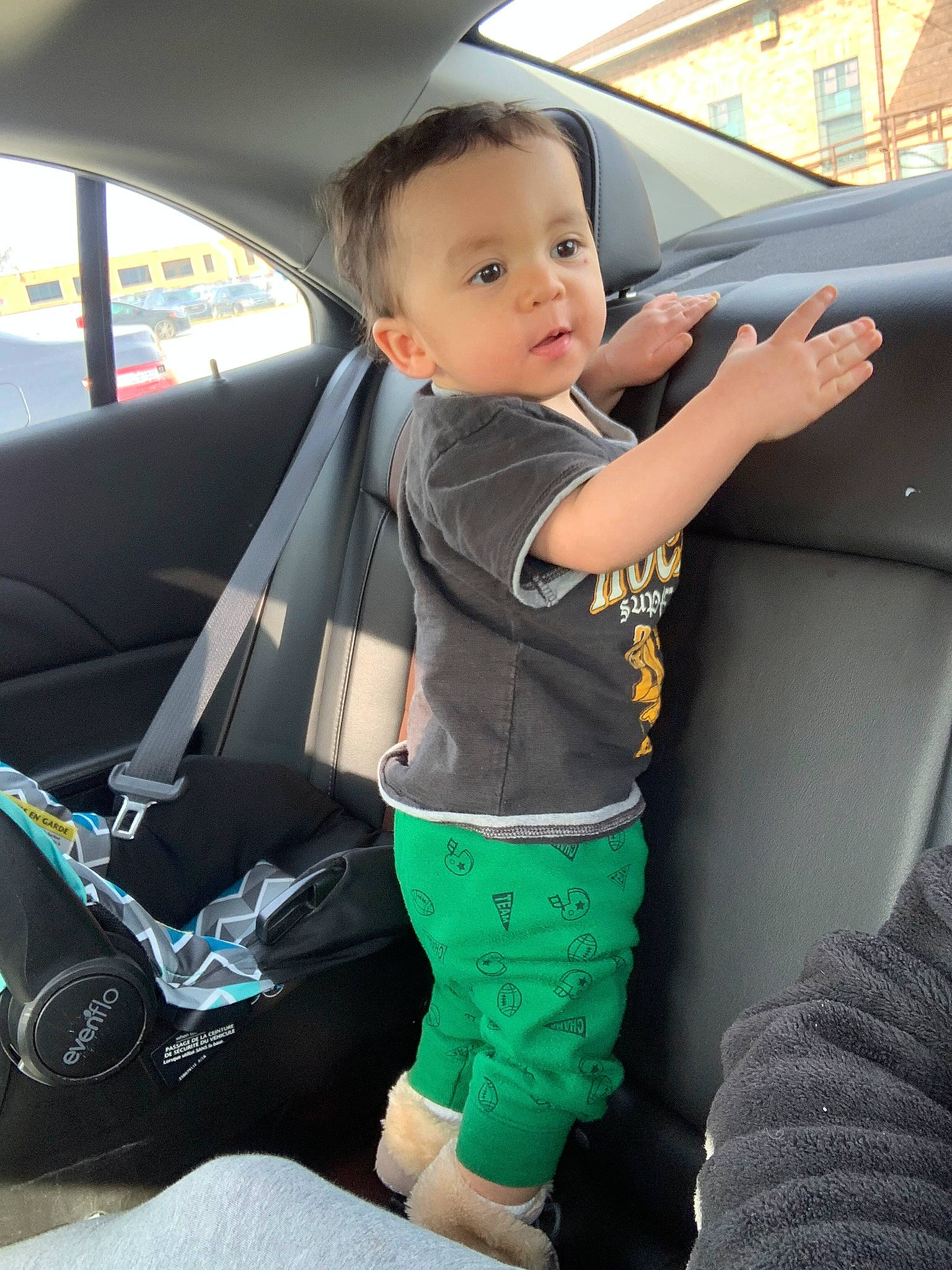 Juno-reed is registered to the contest to win money with this photo: arm, auto_part, automotive_design, automotive_exterior, automotive_window_part, car, car_seat, car_seat_cover, family_car, finger, gesture, hood, leg, motor_vehicle, person, steering_wheel, toddler, vehicle, vehicle_door, window
