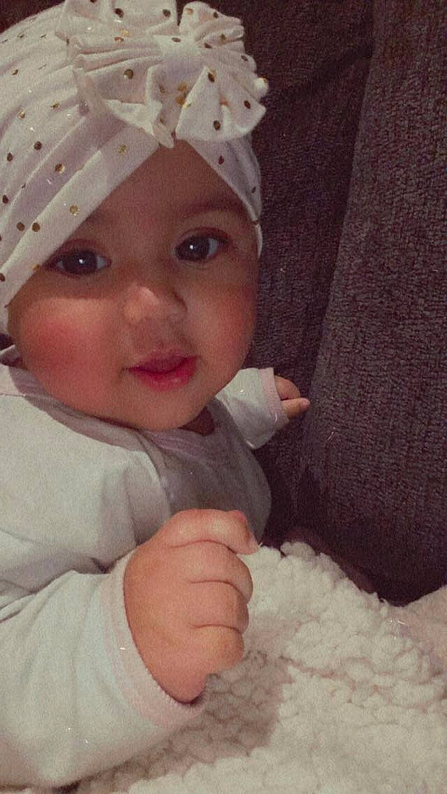 Melody joined the competition — help win amazing prizes! baby, baby_toddler_clothing, cap, cheek, costume_hat, eye, eyebrow, eyelash, gesture, happy, head, headwear, helmet, human_body, nose, outerwear, person, skin, sleeve, smile