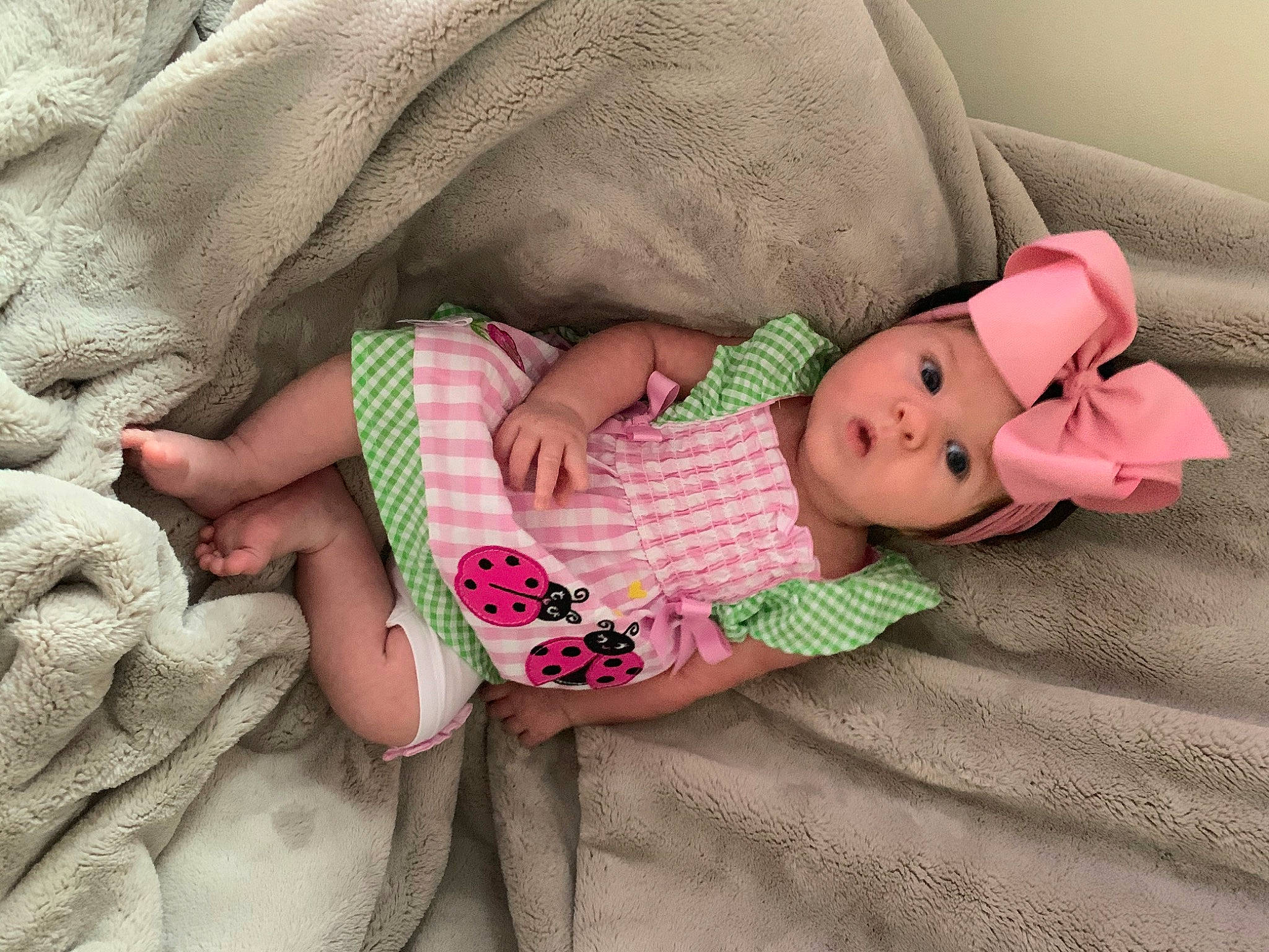 Marie is registered to the contest to win money with this photo: baby, baby_products, baby_sleeping, baby_toddler_clothing, bedding, bedtime, blanket, child, comfort, headwear, linens, nap, person, pink, product, sleep, surprise, textile, toddler
