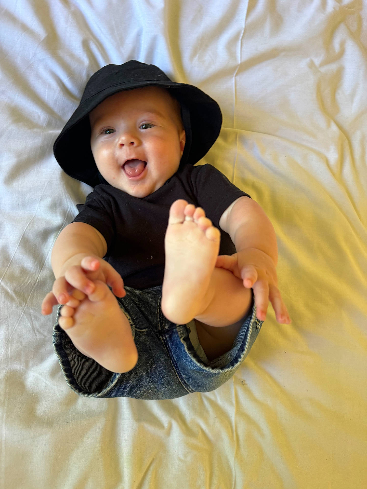 Alby joined the competition — help win amazing prizes! baby, babylaughing, baseballcap, bodypart, cap, clothing, face, finger, hand, happy, hat, head, laughing, pants, person, photography, portrait, sitting, smile, sunhat