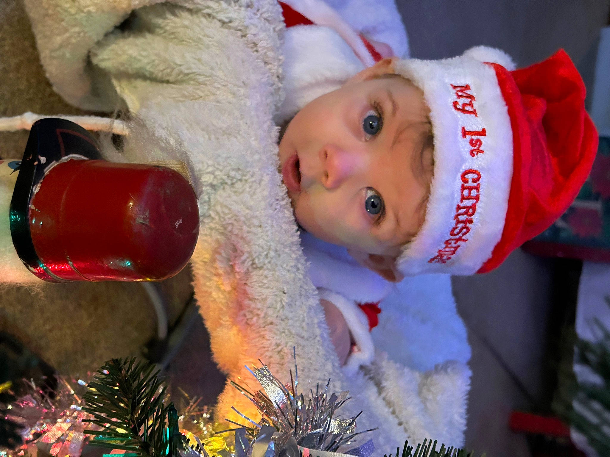 Noah joined the competition — help win amazing prizes! baby, carmine, christmas, christmas_decoration, christmas_eve, christmas_ornament, christmas_tree, drink, event, facial_expression, fictional_character, fun, happy, headwear, holiday, holiday_ornament, ornament, person, santa_claus, toddler