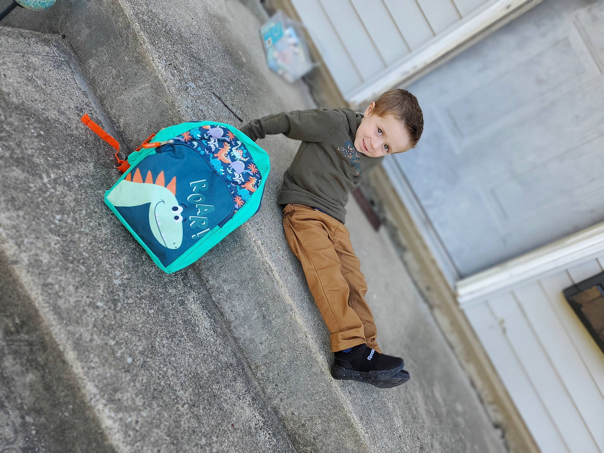 William joined the competition — help win amazing prizes! asphalt, boot, concrete, cool, denim, eyewear, fashion_accessory, font, grey, joy, leisure, outdoor_shoe, person, recreation, road_surface, sidewalk, sitting, sleeve, soil, street